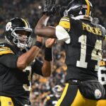 Pittsburgh Steelers wide receiver George Pickens (14) celebrates an 11 yard touchdown pass with quarterback Russell Wilson (3) iagainst the New York Jets during the second quarter at Acrisure Stadium.