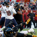 Chicago Bears quarterback Caleb Williams (18) passes the ball as Washington Commanders linebacker Frankie Luvu (4) and Commanders linebacker Bobby Wagner (54) defend during the second quarter at Northwest Stadium.