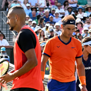 Nick Kyrgios (AUS) and Rafael Nadal (ESP) change sides during their quarterfinal match at the BNP Paribas Open at the Indian Wells Tennis Garden.