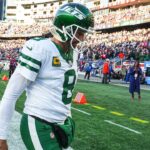 New York Jets quarterback Aaron Rodgers (8) exits the field after being defeated by the New England Patriots in the second half at Gillette Stadium.
