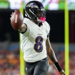 Oct 21, 2024; Tampa, Florida, USA; Baltimore Ravens quarterback Lamar Jackson (8) runs with the ball against the Tampa Bay Buccaneers in the second quarter at Raymond James Stadium.