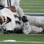 Dallas Cowboys linebacker Micah Parsons (11) injured in the second half against the New York Giants at MetLife Stadium.
