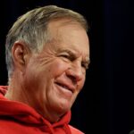 Bill Belichick smiles during questions at a press conference.