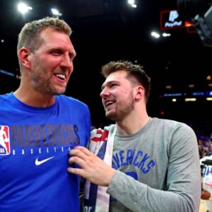 Dallas Mavericks guard Luka Doncic (77) greets former player Dirk Nowitzki after beating the Phoenix Suns in game seven of the second round for the 2022 NBA playoffs at Footprint Center.