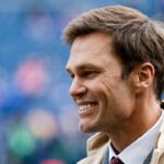 FOX commentator Tom Brady stands on the sideline before a game between the Seattle Seahawks and Buffalo Bills at Lumen Field.