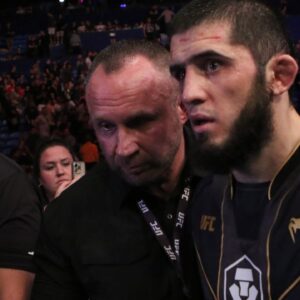 Islam Makhachev (red gloves) celebrates after defeating Alexander Volkanovski (not pictured) for the lightweight championship during UFC 284 at RAC Arena.