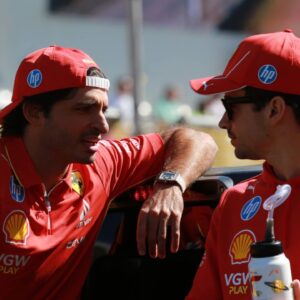 Carlos Sainz and Charles Leclerc have a conversation at the driver s parade