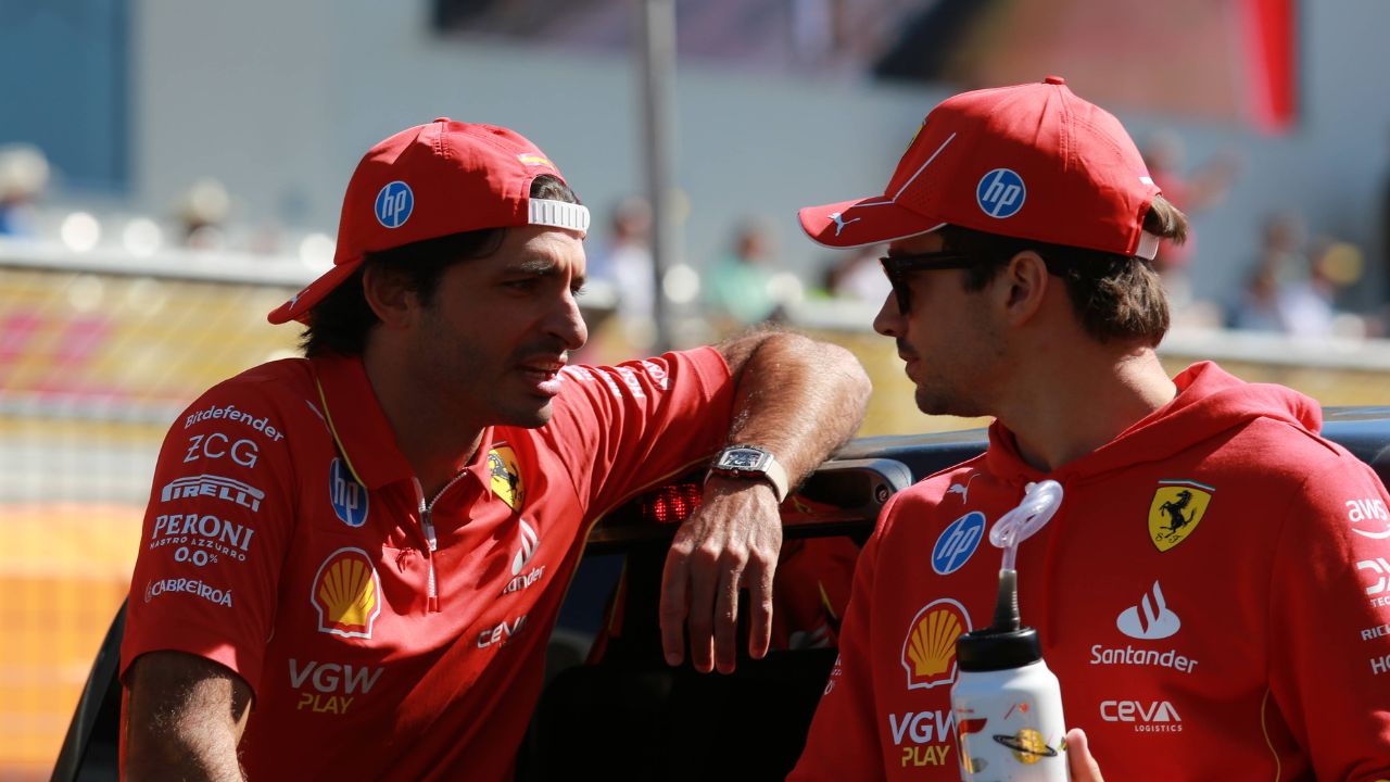 Carlos Sainz and Charles Leclerc have a conversation at the driver s parade