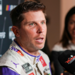 Denny Hamlin speaks to media members during the NASCAR Playoffs Media Day at the Charlotte Convention Center.