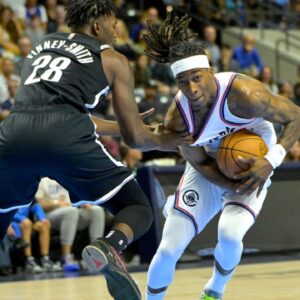 Brooklyn Nets forward Dorian Finney-Smith (28) guards Los Angeles Clippers guard Terance Mann (14) as he drives to the basket in the first half at Frontwave Arena.