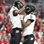 Oct 21, 2024; Tampa, Florida, USA; Baltimore Ravens wide receiver Rashod Bateman (7) is congratulated by quarterback Lamar Jackson (8) after he scored a touchdown against the Tampa Bay Buccaneers during the second half at Raymond James Stadium.