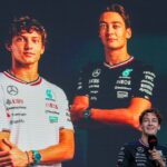 George Russell (63) of the United Kingdom speaks at the Fan Forum with a photo of himself and future teammate Andrea Kimi Antonelli