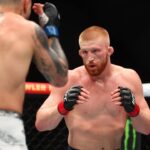 Bo Nickal (red gloves) fights Cody Brundage (blue gloves) during UFC 300 at T-Mobile Arena.