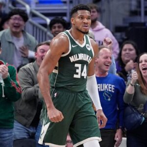 Milwaukee Bucks forward Giannis Antetokounmpo (34) after dunking the ball against the Chicago Bulls in the first half at Fiserv Forum.