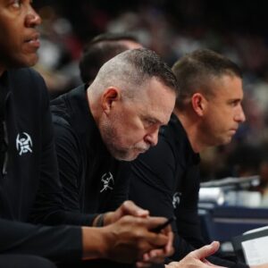 Denver Nugget head coach Michael Malone on the bench in the second half against the Oklahoma City Thunder at Ball Arena