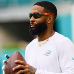 Miami Dolphins wide receiver Odell Beckham Jr. (3) throws the football before preseason game against the Washington Commanders at Hard Rock Stadium.