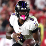 Baltimore Ravens quarterback Lamar Jackson (8) runs with the ball against the Tampa Bay Buccaneers during the second half at Raymond James Stadium.