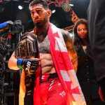 Ilia Topuria celebrates his championship victory against Alexander Volkanovski during UFC 298 at Honda Center.