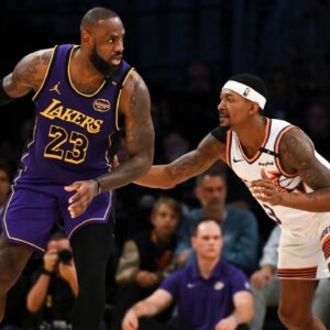 Oct 25, 2024; Los Angeles, California, USA; Los Angeles Lakers forward LeBron James (23) looks to pass against Phoenix Suns guard Bradley Beal (3) during the second half at Crypto.com Arena. Mandatory Credit: Jonathan Hui-Imagn Images