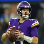 Minnesota Vikings quarterback Sam Darnold (14) throws the ball against the Los Angeles Rams in the first half at SoFi Stadium.