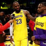 NBA on TNT sideline reporter Taylor Rooks interviews Los Angeles Lakers forward LeBron James (23) and guard Bronny James (9) after they defeated the Minnesota Timberwolves at Crypto.com Arena.
