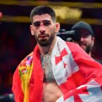 Ilia Topuria celebrates his championship victory against Alexander Volkanovski during UFC 298 at Honda Center.