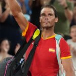 Rafael Nadal (ESP) waves to the crowd after losing to Austin Krajicek and Rajeev Ram (USA) in a men's doubles quarterfinal tennis match during the Paris 2024 Olympic Summer Games at Stade Roland Garros