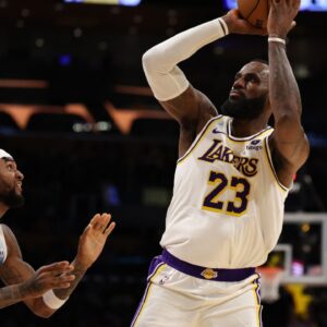 Lakers forward LeBron James (23) shoots the ball over Minnesota Timberwolves guard Nickeil Alexander-Walker (9) during the second quarter at Crypto.com Arena.