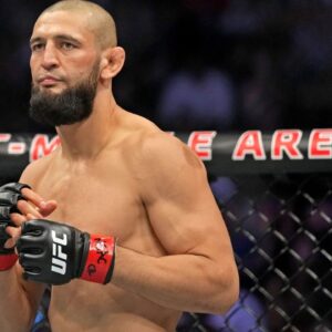 Khamzat Chimaev (red gloves) fights Kevin Holland (blue gloves) during UFC 279 at T-Mobile Arena.