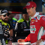 NASCAR Cup Series driver Ryan Blaney (L) talks with NASCAR Cup Series driver Joey Logano (R) during practice for the Straight Talk Wireless 400 at Homestead-Miami Speedway.