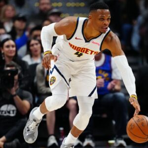 Denver Nuggets guard Russell Westbrook (4) dribbles up court in the second half against the Oklahoma City Thunder at Ball Arena.