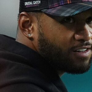 Miami Dolphins quarterback Tua Tagovailoa stands on the sidelines during the second half against the Tennessee Titans at Hard Rock Stadium.