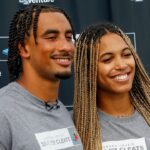 Green Bay Packers quarterback Jordan Love and his fiancée, Ronika Stone, pose for a photo at Green Bay West High School in Green Bay, Wis. Love’s foundation, Hands of 10ve, is partnering with U.S. Venture to give youth football teams a set of new cleats for each touchdown Love runs or throws for in the 2024 season. Teams will be able to apply for cleats in December, and cleats will be given to teams based on need.