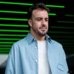 Fernando Alonso Aston Martin Aramco Formula One Team, Spain, 14 stands with matching shirt outfit to his 400 Grand Prix in front of the garage, MEX, Formula 1 World Championship, Grand Prix of Mexico City, Autodromo Hermanos Rodriguez