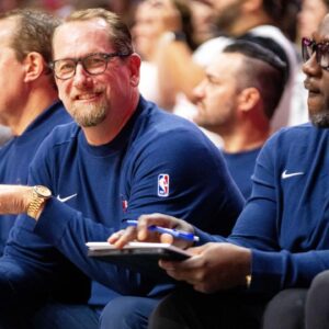 Philadelphia head coach Nick Nurse smiles from the bench on Friday, Oct. 11, 2024, at Wells Fargo Arena in Des Moines.