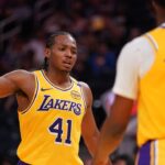 Los Angeles Lakers guard Quincy Olivari (41) gives a high five to guard Bronny James (9) after a play against the Golden State Warriors in the third quarter at the Chase Center.