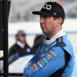 NASCAR Cup Series driver Kyle Busch looks at a computer on pit road during practice and qualifying for the Wurth 400 at Dover Motor Speedway.