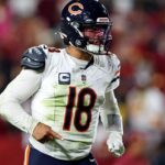 Chicago Bears quarterback Caleb Williams (18) celebrates after the Bears scored a touchdown during the fourth quarter against the Washington Commanders at Commanders Field.
