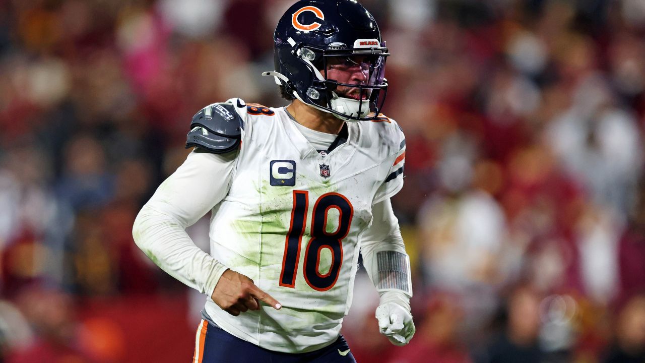 Chicago Bears quarterback Caleb Williams (18) celebrates after the Bears scored a touchdown during the fourth quarter against the Washington Commanders at Commanders Field.