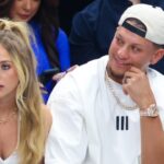 Kansas City Chiefs quarterback Patrick Mahomes II sits with his wife Brittany and tight end Travis Kelce during the game between the Dallas Mavericks and Minnesota Timberwolves during game three of the western conference finals for the 2024 NBA playoffs at American Airlines Center.
