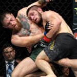 Khabib Nurmagomedov (red gloves) fights Conor McGregor (blue gloves) during UFC 229 at T-Mobile Arena.