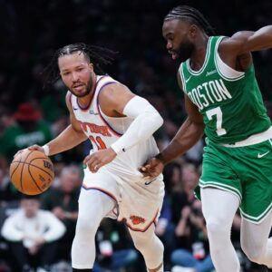 Boston Celtics guard Jaylen Brown (7) defends against New York Knicks guard Jalen Brunson (11) in the second half at TD Garden.