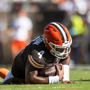 Cleveland Browns quarterback Deshaun Watson (4) falls to the ground with a torn Achilles during the second quarter against the Cincinnati Bengals at Huntington Bank Field