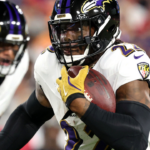 Baltimore Ravens running back Derrick Henry (22) runs with the ball against the Tampa Bay Buccaneers during the first half at Raymond James Stadium.