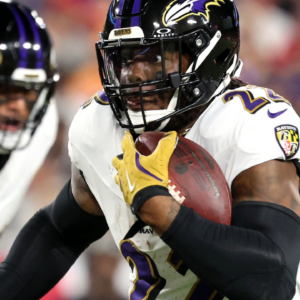 Baltimore Ravens running back Derrick Henry (22) runs with the ball against the Tampa Bay Buccaneers during the first half at Raymond James Stadium.