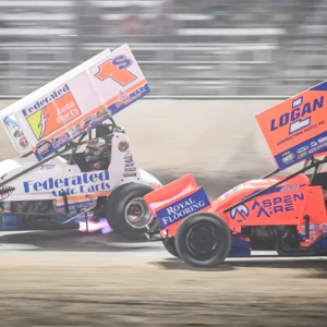 Logan Schuchart (1s) and Giovanni Scelzi (18) race down the front straight in the World of Outlaws Larry Hillerud Badger 40 on Friday, July 12, 2024, at the Wilmot Raceway in Wilmot, Wisconsin.
