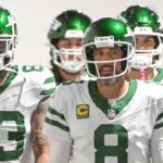 New York Jets quarterback Aaron Rodgers (8) walks onto the field for a game against the Pittsburgh Steelers at Acrisure Stadium.