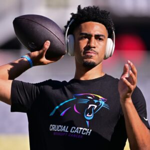 Carolina Panthers quarterback Bryce Young (9) warms up before the game against the Chicago Bears at Soldier Field.