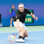 Taylor Fritz returns a shot during the men's singles final of the 2024 U.S. Open tennis tournament at USTA Billie Jean King National Tennis Center
