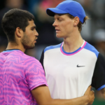 Carlos Alcaraz and Jannik Sinner meet at the net after their semifinal match at the BNP Paribas Open in Indian Wells